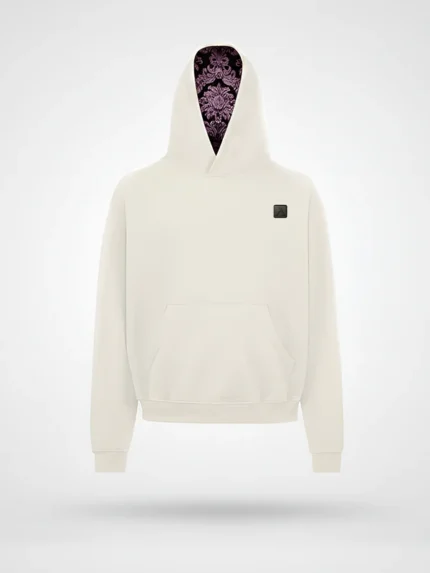 Vista frontal de la sudadera Faaia blanco coco con capucha forrada en damasco marrón y rosa.