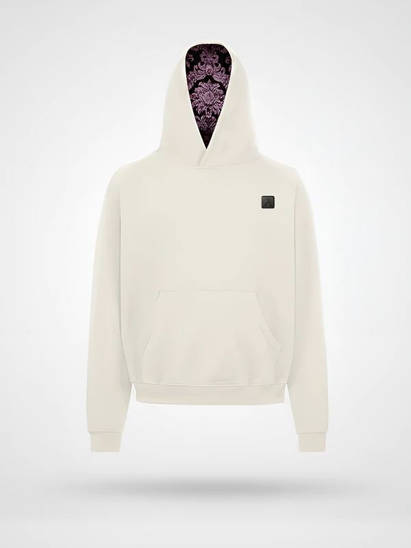 Vista frontal de la sudadera Faaia blanco coco con capucha forrada en damasco marrón y rosa.