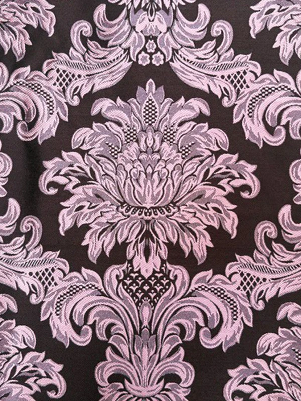 Detalle del damasco marrón y rosa utilizado en la capucha de la sudadera Faaia blanco coco.