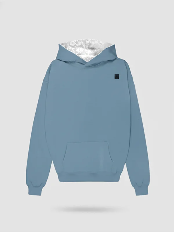 Plano frontal de sudadera en color citadel con la capucha en damasco blanco tono sobre tono de la marca Faaia.