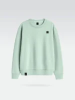 Sudadera de la marca Faaia de color verde Claro con un parche de micro inyeccion en el pecho.