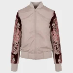 Imagen frontal de chaqueta para mujer color beige con las mangas forradas con un brocatel color burdeos tejido en telar valenciano.