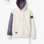 Sudadera marca faaia con damasco morado y plata en manga.